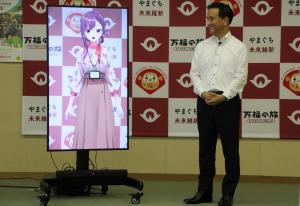 歓談する村岡知事の写真